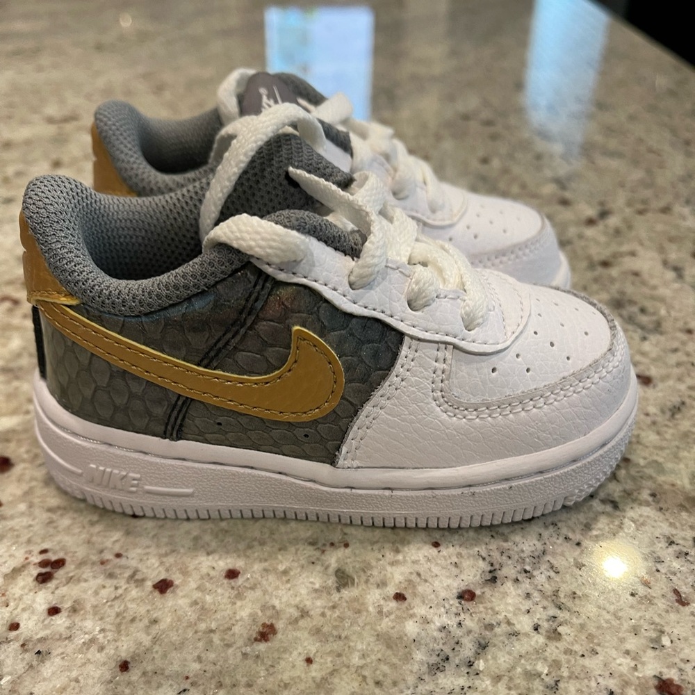 Brand new Nike Air Force 1 metallic gold